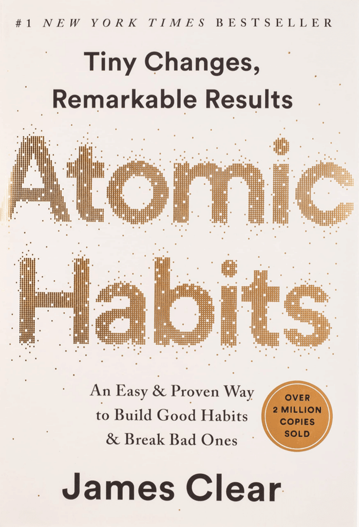 Cover of the book Atomic Habits by James Clear with the title in large gold text.