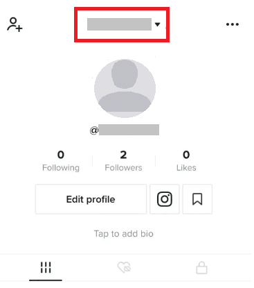 Go to your TikTok profile and tap on the drop-down arrow at the top.