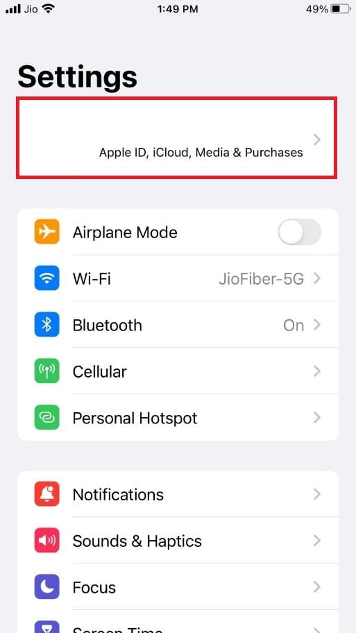 At the top of the screen, tap on the Apple ID