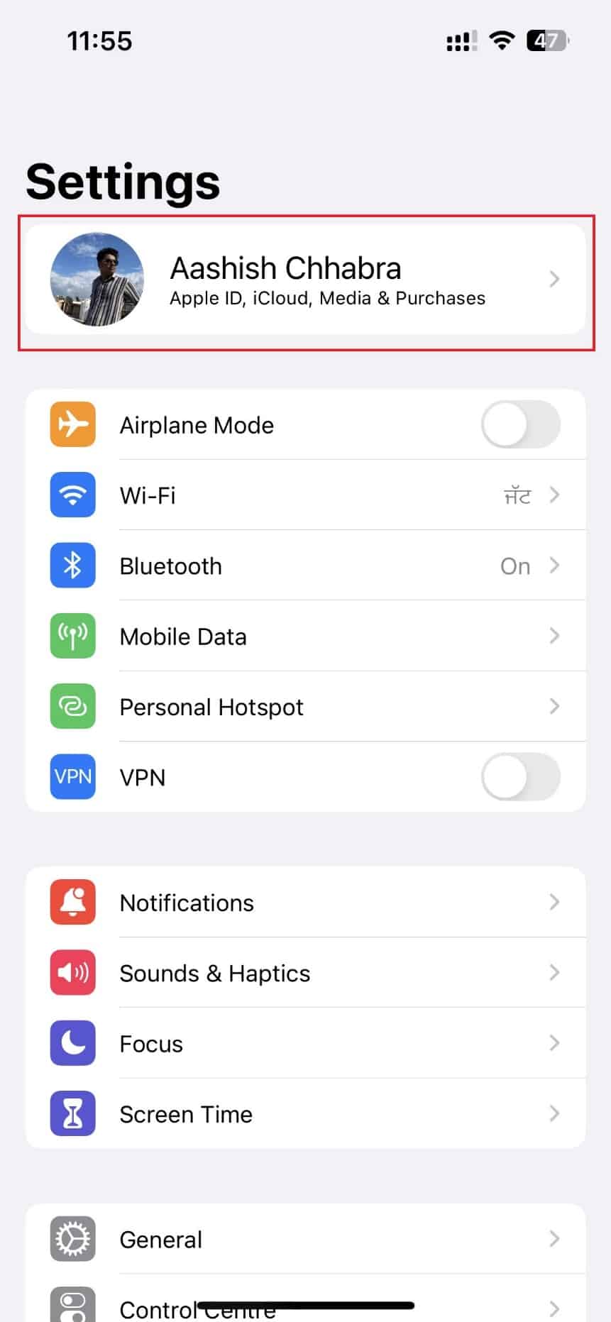 Tap your name at the top of the Settings page to go to your Apple ID page.