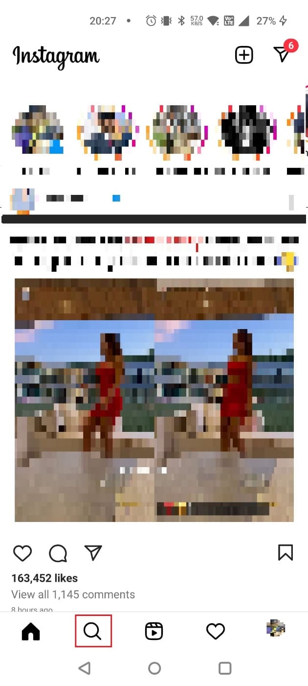 Tap on the Magnifying glass icon to go to the Explore feed