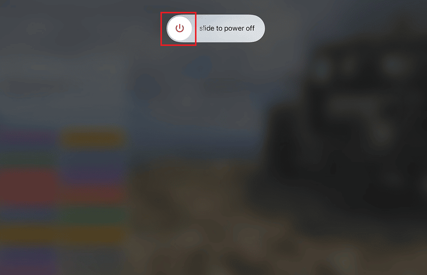 Once the slide to power off option is visible, swipe right the red and white power icon to turn off the device from left to right to power it off