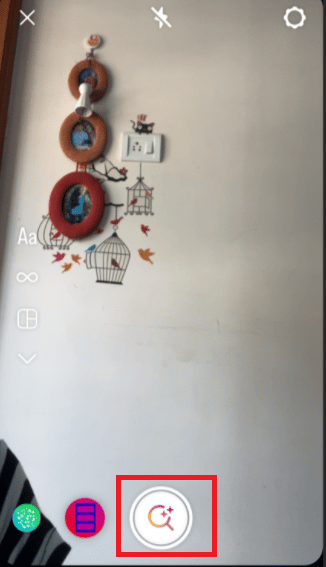 Next, go to your story and tap on the magnifying glass icon which appears after you slide all filters. 