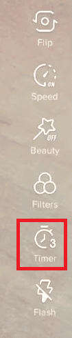 Tap on the Timer icon before starting to record